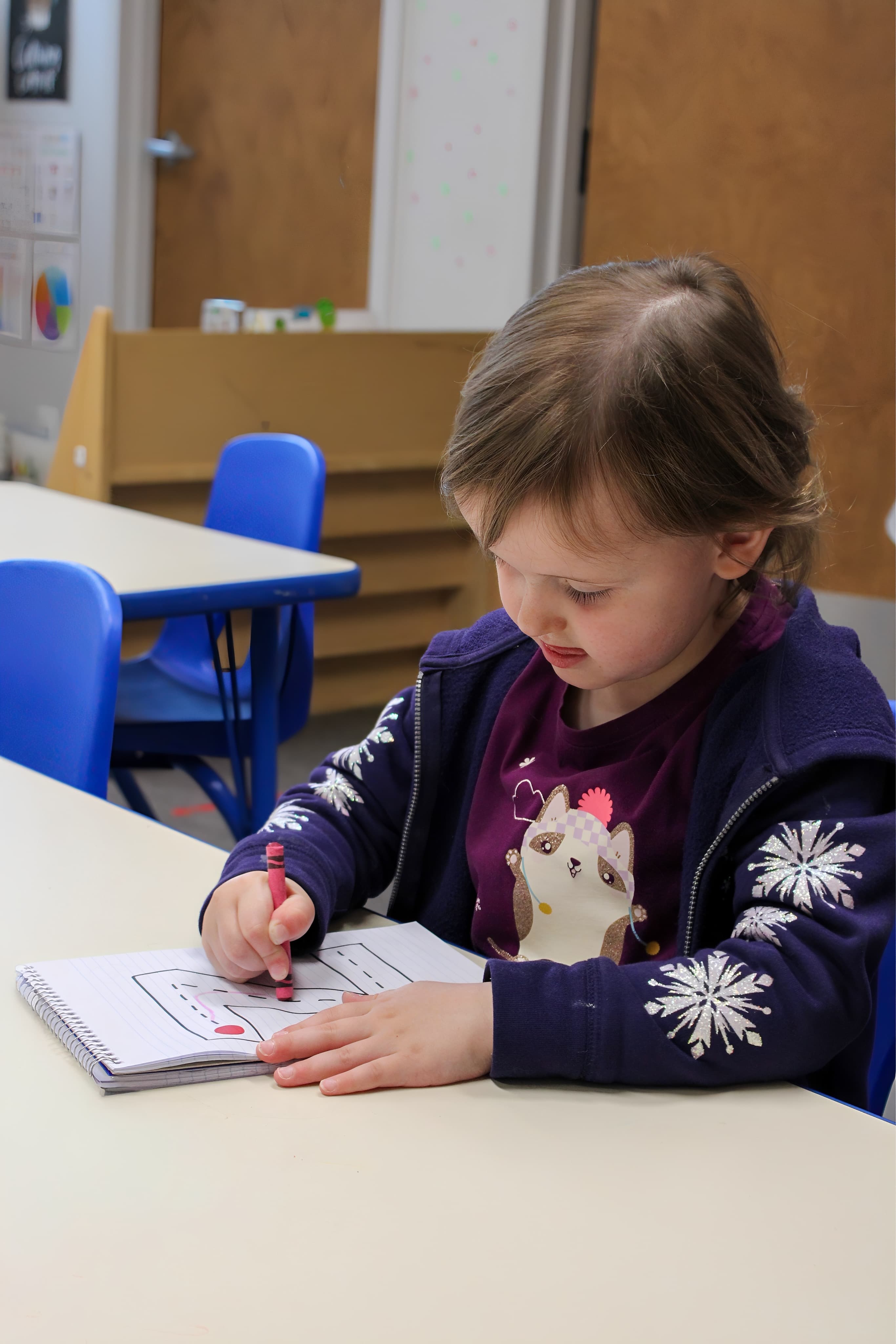 A quiet moment of focused play at Rainbow Years